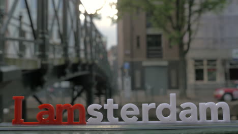 amsterdam slogan on city view background