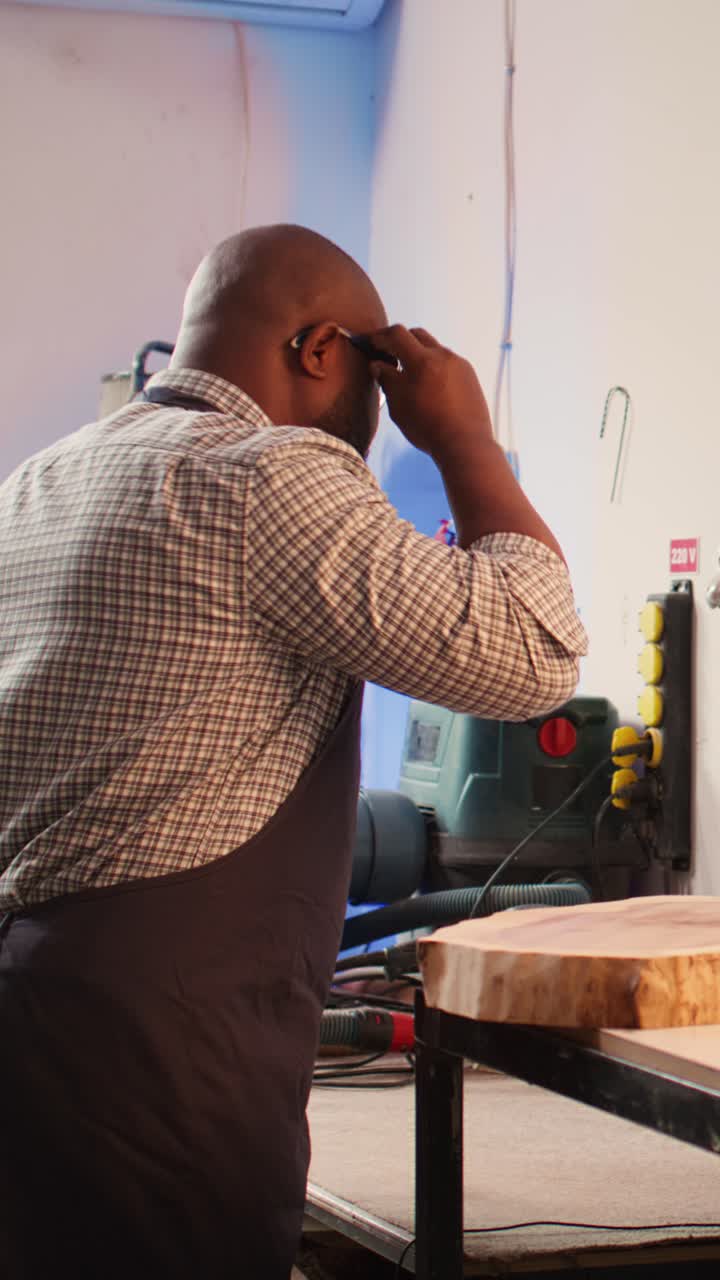 African American Man Working on Wood in Workshop