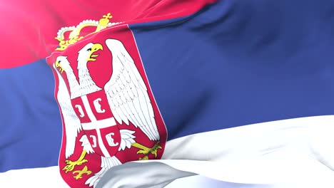 serbia flag waving at wind in slow with blue sky, loop