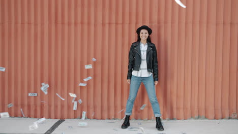 woman celebrating success with money falling around her