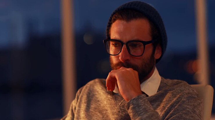 Thoughtful business executive sitting in office