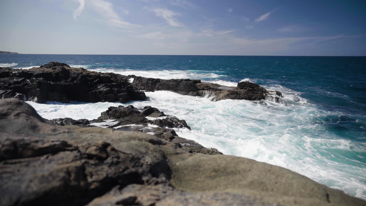 Wide view over lava rocks at the coast of Fuerteventura, Canary islands
