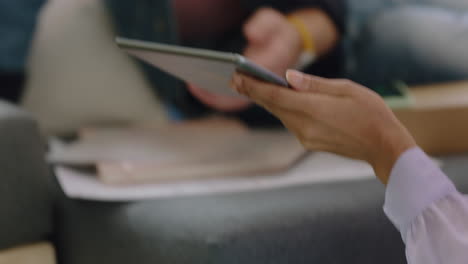 close-up-young-diverse-students-using-digital-tablet-computer-discussing-market-research-data-on-mobile-device-screen-sharing-graph-statistics-enjoying-teamwork-project-office