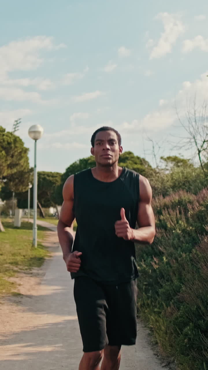 Young Man Jogging in the Park