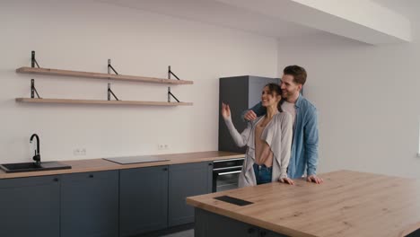 Caucasian-couple-very-excited-while-watching-their-new-house