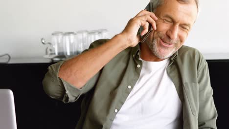 male executive talking on mobile phone