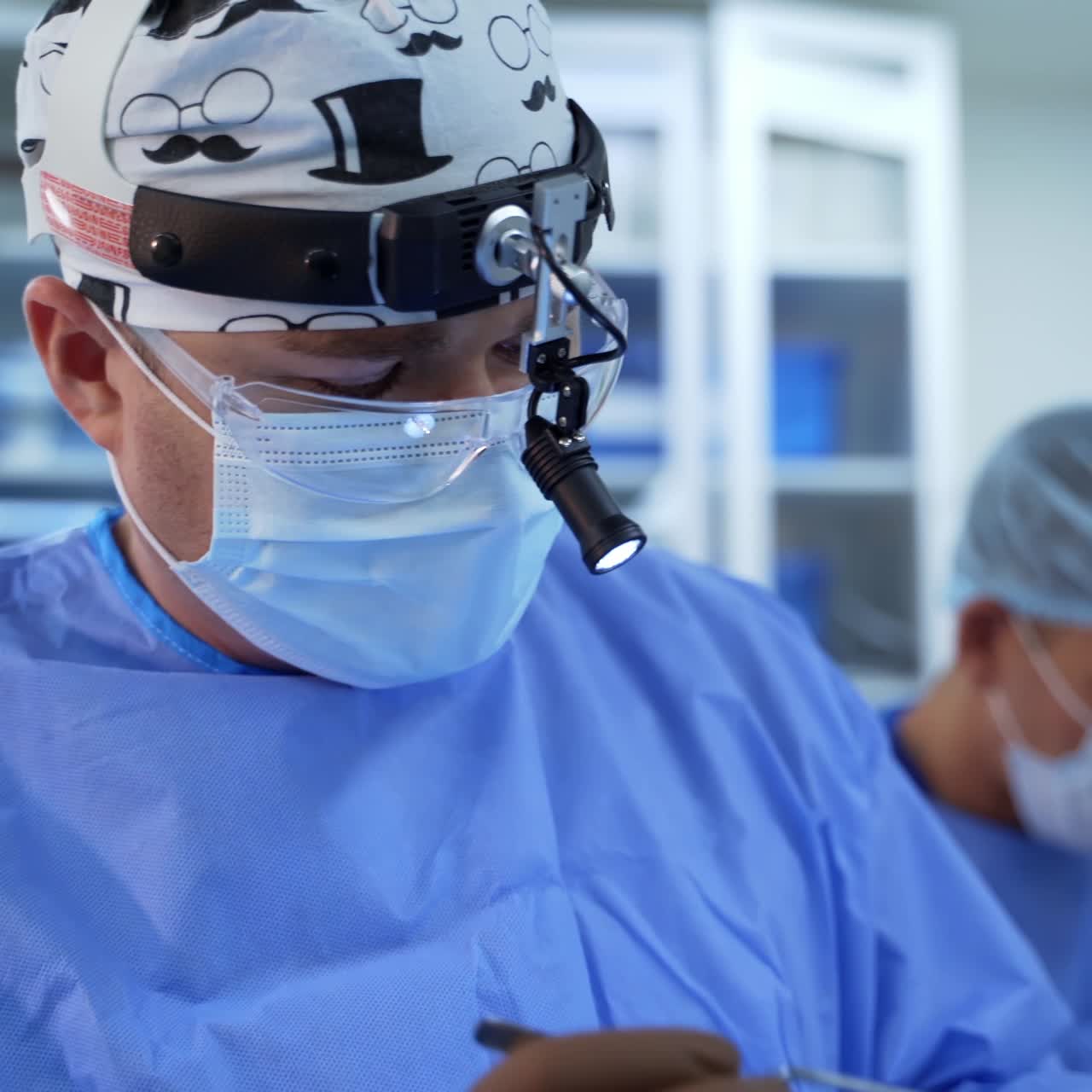 In surgery. Medical team performing operation in hospital operating theater. Working with surgical instruments