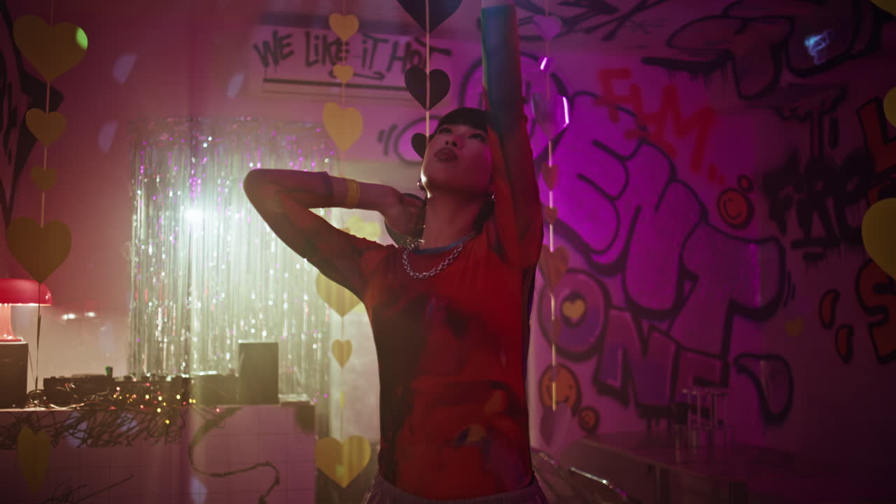 millennial dancing club raising hands to disco ball closeup. Carefree girl