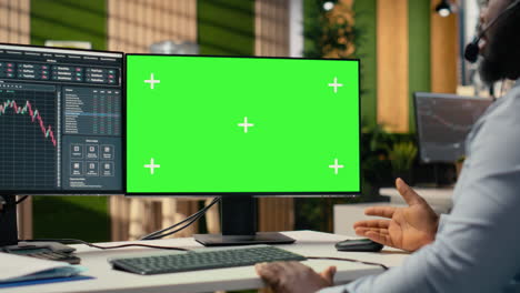 financial advisor in office offers investment guidance during call with client