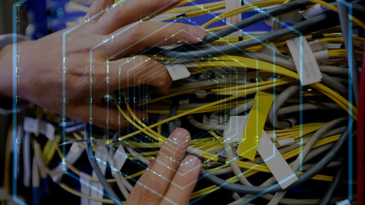 Hands holding cables with hexagon then code lines