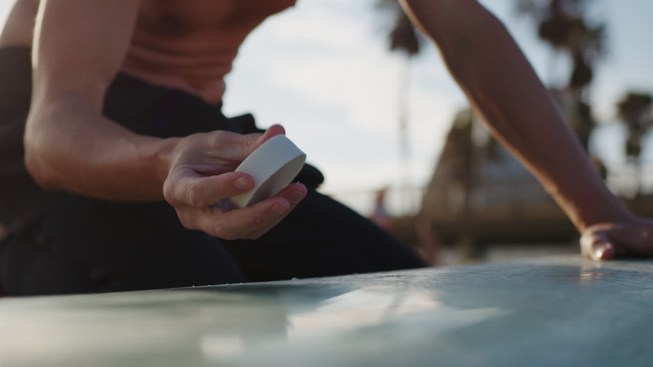 Surfer man walking to the beach at sunset preparing for surfing training and search for waves in Barcelona, spain, water, ocean exercise in sea with board, athletic male holiday or travel in vacation