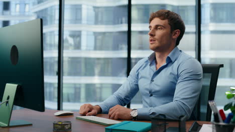 satisfied businessman relaxing dreaming at office closeup. man having break