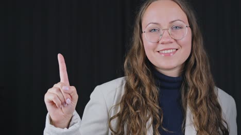 professional female marketer pointing to a product upwards