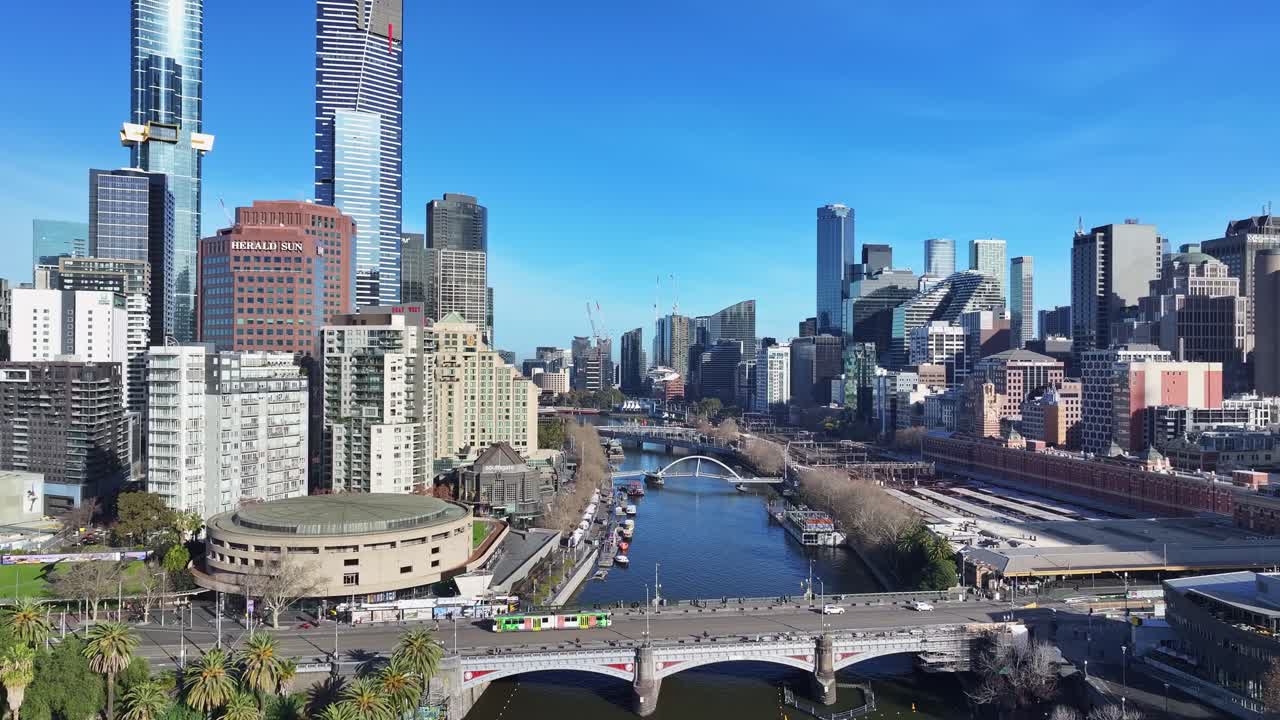 Central Melbourne skyline with trams crossing Princes Bridge above the Yarra River