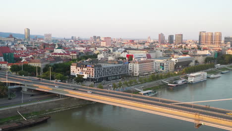 wide drone shot of bratislava, slovakia with the bridge of the slovak national uprising in the foreground