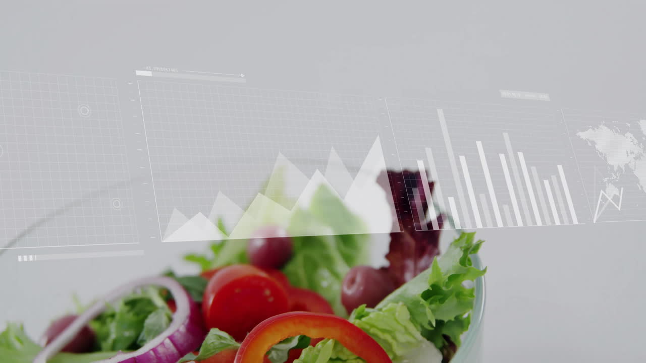 Overlaying data analytics graphs, fresh salad showing nutritional information