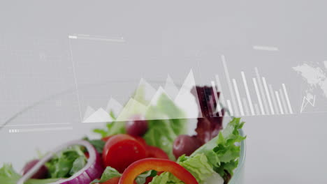 overlaying data analytics graphs, fresh salad showing nutritional information