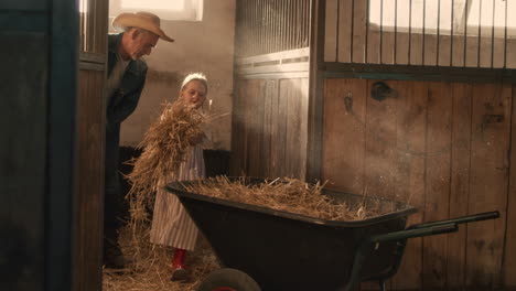 grandparent and grandchild working together in a stable