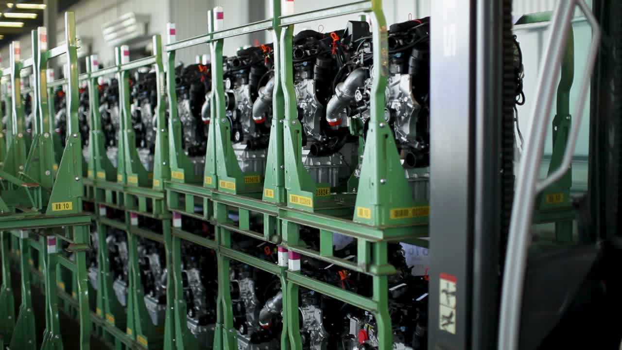 Rows of neatly arranged industrial engines in a factory, ready for distribution
