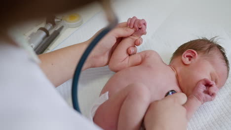 doctor examining a newborn baby