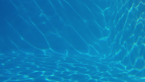 underwater shot of blue swimming pool