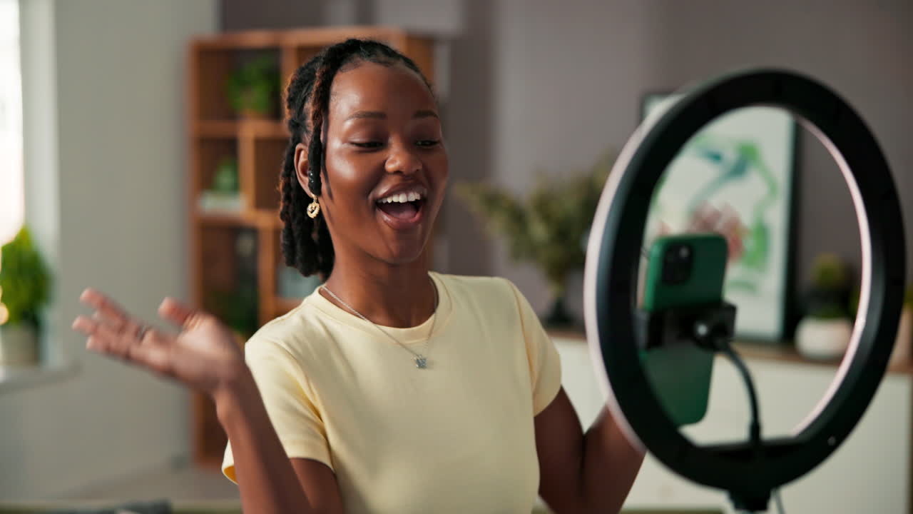 Woman vlogging indoors with ring light