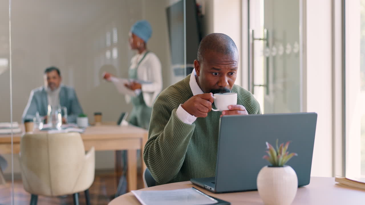 African businessman, coffee and laptop in office