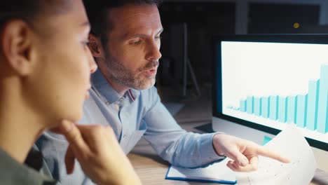 caucasian woman and man analyzing success of them