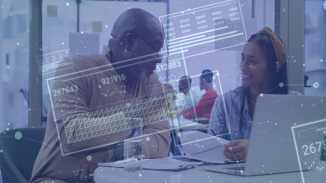 Business professionals collaborating at desk with digital data overlay animation