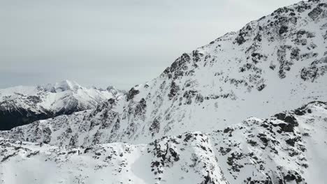 hiking along snowcapped peaks in the tatras mountains in morskie oko park in zakopane poland