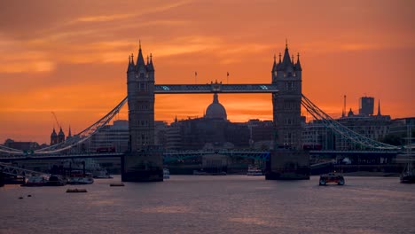 day to night time lapse view of the lifted tower bridge in london