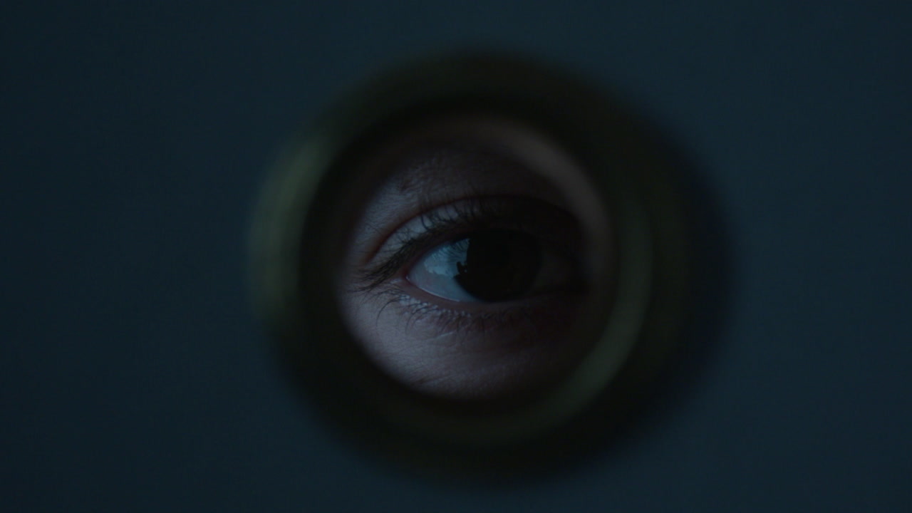Eye Peeking Through Peephole