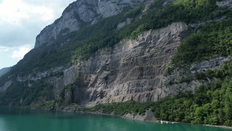 Dreamlike-fantasy-scene-of-majestic-rocky-Alps-adorning-shoreline,Switzerland