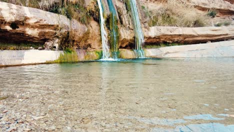 a waterfall in the middle of the sahara desert algeria biskra