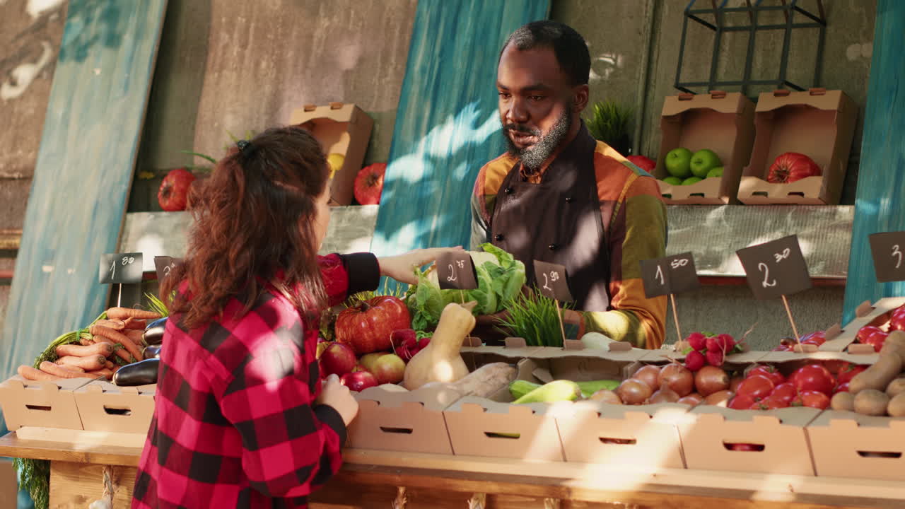 People buying and selling fresh produce at a local farmer's market