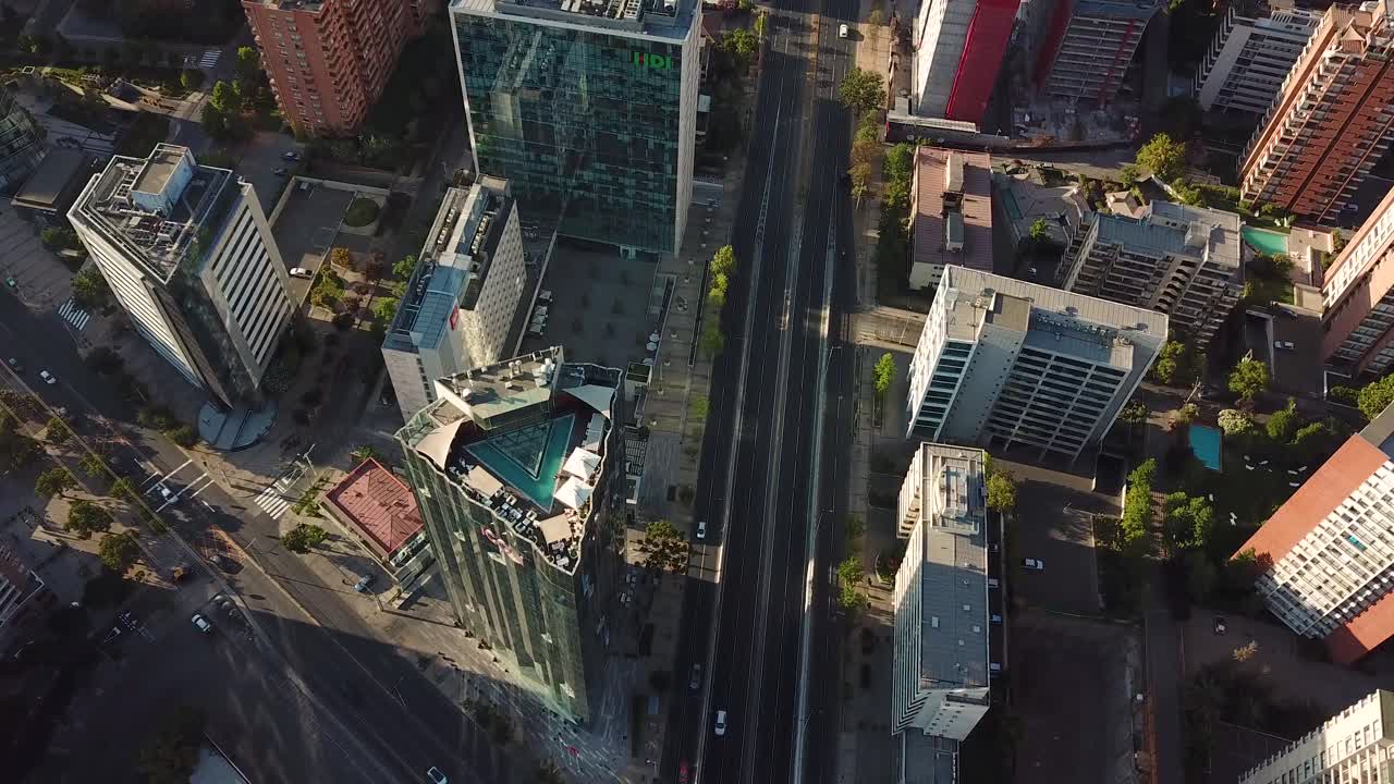 Santiago de Chile. Cinematic Drone Aerial View of Road Traffic Between Modern Skyscrapers