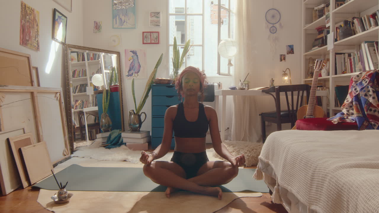 Black Girl Meditating during Home Yoga Practice