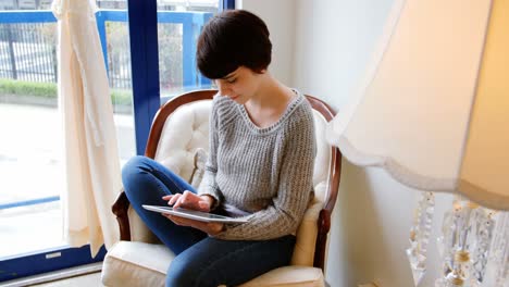 woman using digital tablet