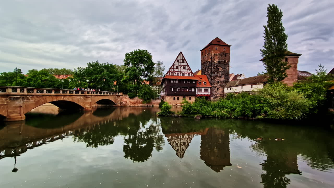 Maxbrucke Bridge and Wasserturm Tower Reflecting in Pegnitz River in Nuremberg