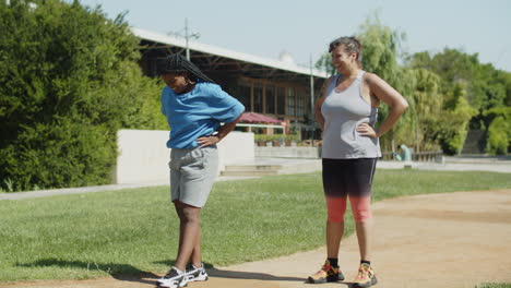 Long-shot-of-happy-overweight-women-сoming-to-tapes