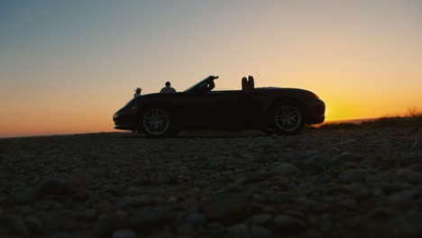 a young couple walks away from their car