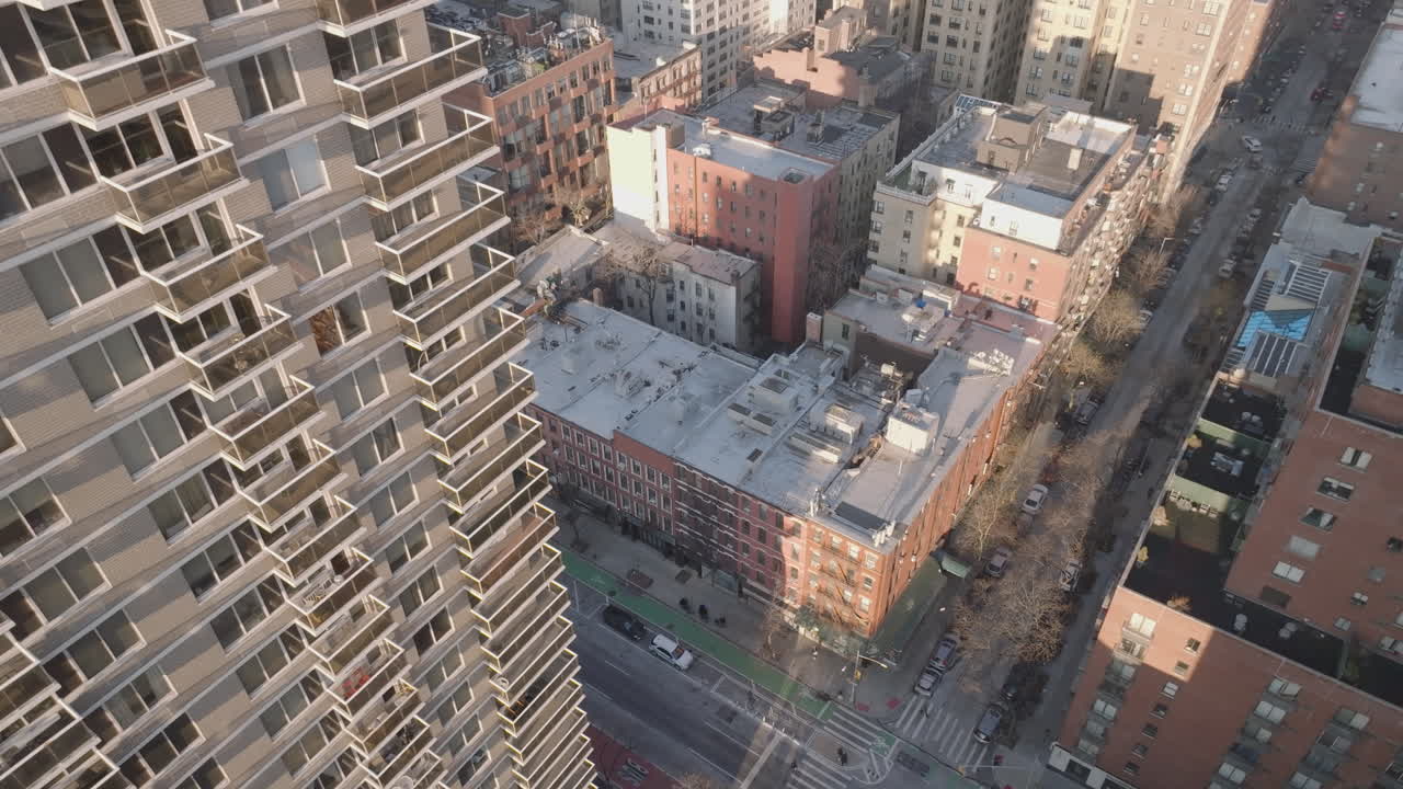 Drone point of view of an apartment building in New York City. Shot at sunrise during the winter on Manhattan’s Upper East Side.