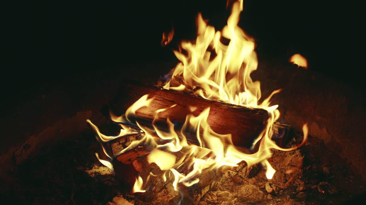 Campfire Flames Flicker and Glow in Outdoor Wilderness