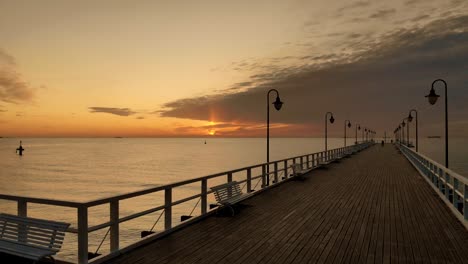 slowly floating over a wooden pier