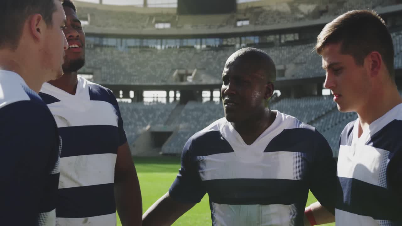 Male rugby players standing together in stadium 4k