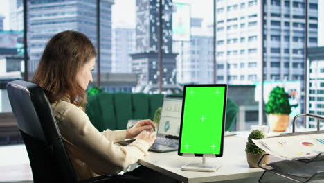 Young-business-manager-working-with-isolated-copy-space-on-her-tablet