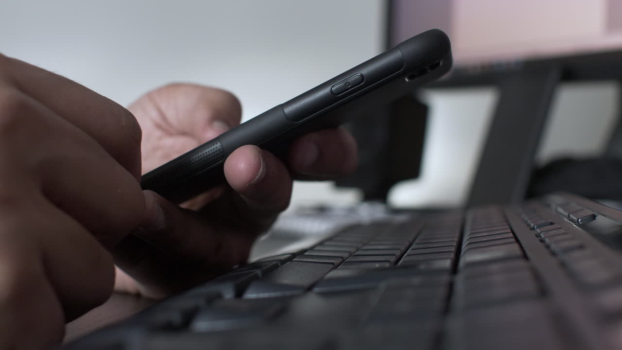 Fingers Scrolling On Mobile Above Keyboard