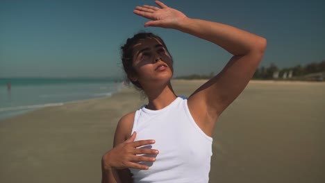 young woman staring into the sun and looking around, searching