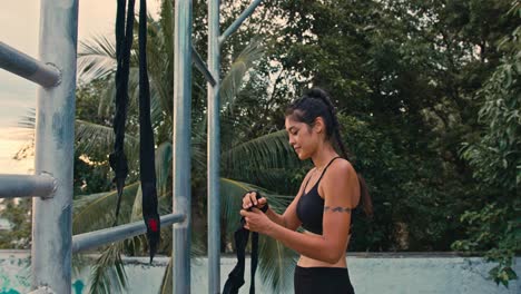 woman preparing for boxing workout outdoors