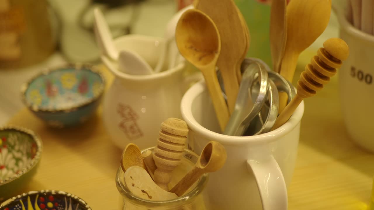 Collection of Wooden Kitchen Utensils and Honey Dippers